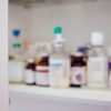 A blurry shot of someone’s prescriptions in a medicine cabinet