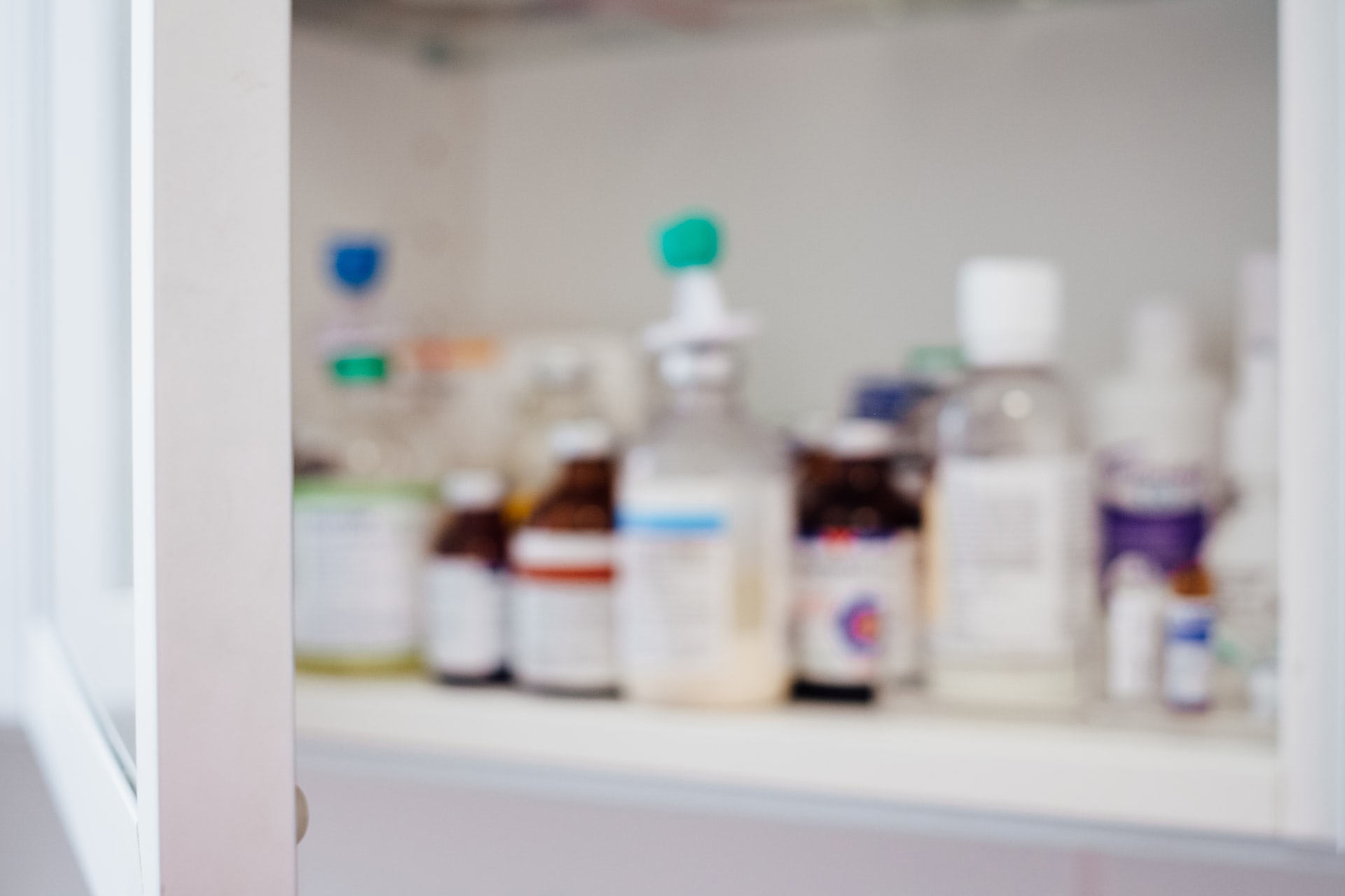 A blurry shot of someone’s prescriptions in a medicine cabinet