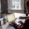 Person with laptop on their desk