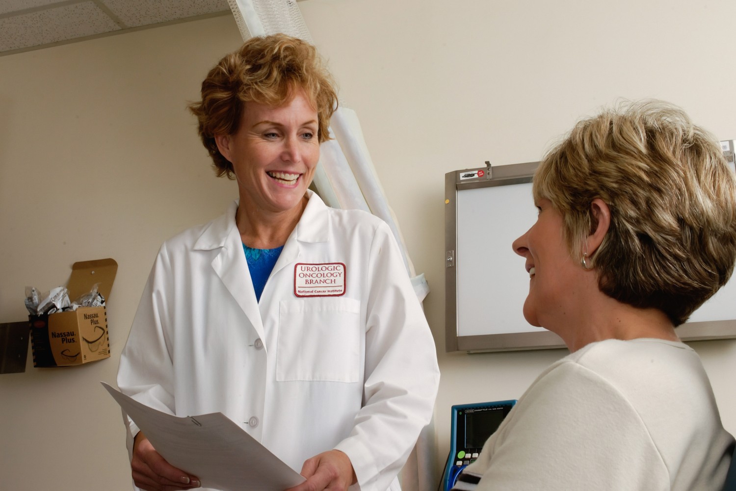 A female doctor talking to a patient