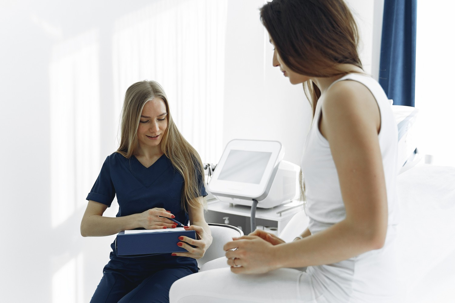 A woman visiting a physician for a regular health check up